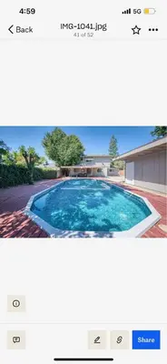 a screenshot of a webpage of a swimming pool at Del Mar pool Home in Fresno