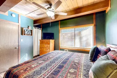 a bedroom with a bed and a ceiling fan at Kelly's Kastle in Incline Village