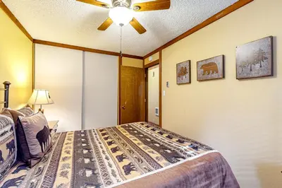 a bedroom with a bed and a ceiling fan at Kelly's Kastle in Incline Village