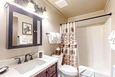 a bathroom with a sink and a toilet at Kelly's Kastle in Incline Village