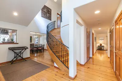 a hallway with a spiral staircase in a home at Silver Rock Lodge in Zephyr Cove
