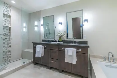 a bathroom with a sink and a mirror and a tub at Crystal Bay Retreat 204 in Crystal Bay