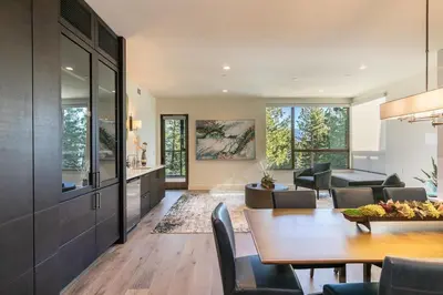 a dining room and living room with a table and chairs at Crystal Bay Retreat 204 in Crystal Bay