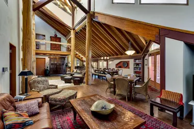 a living room with couches and a table at Downtown Penthouse in South Lake Tahoe
