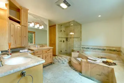a large bathroom with a tub and a shower at Lodgepole Pine Chalet in South Lake Tahoe