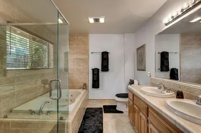 a bathroom with a tub and a sink and a toilet at Panhandle House in South Lake Tahoe