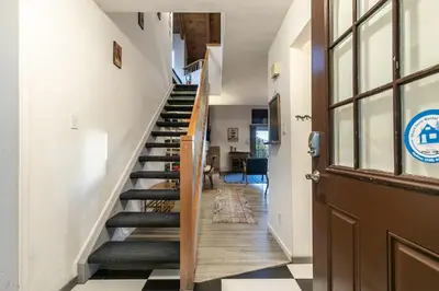 a hallway with a staircase and a door at Stylish 2BD in Carnelian Bay in Carnelian Bay