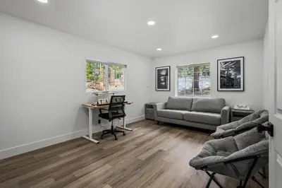 a living room with a couch and a desk at Tahoe Family Friendly Home in Incline Village