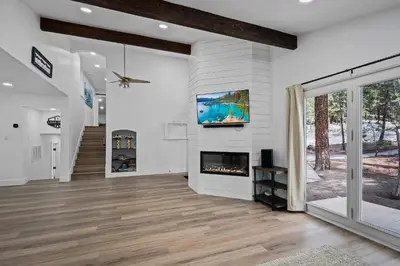 a living room with a fireplace and a tv at Tahoe Family Friendly Home in Incline Village