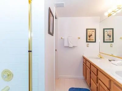 a bathroom with a sink and a shower at 4 bedroom 3 5 bathrooms lake view condo in Incline Village