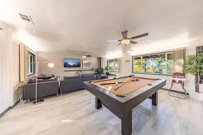 a living room with a pool table in it at Starry Night Cabin at Sky Ranch in Oakhurst
