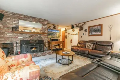 a living room with a couch and a fireplace at Serene 5BDR Near Beach and Forest Trails in Carnelian Bay