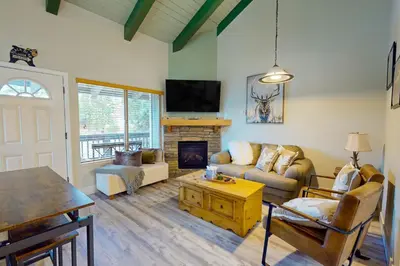 a living room with a couch and a fireplace at Stagecoach Ski Condo in Stateline