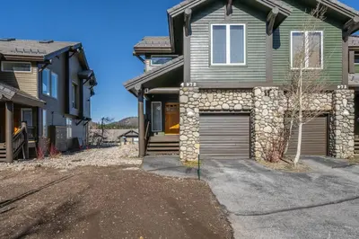 a house with a garage in the driveway at Snowcreek V 972 in Mammoth Lakes