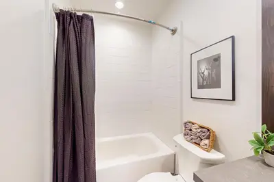 a bathroom with a white tub and a toilet at Creekhouse 1362 in Mammoth Lakes