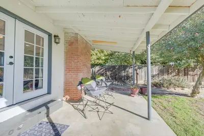 a patio with two chairs on a porch at Visalia Vacation Rental with Yard 1 Mi to Downtown in Visalia