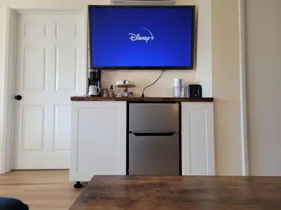a flat screen tv sitting on top of a table at Peaceful Yosemite Retreat-King Suite-Pet Friendly in Oakhurst
