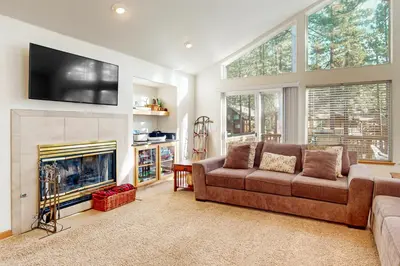 a living room with a couch and a fireplace at High Meadow Hideaway in South Lake Tahoe