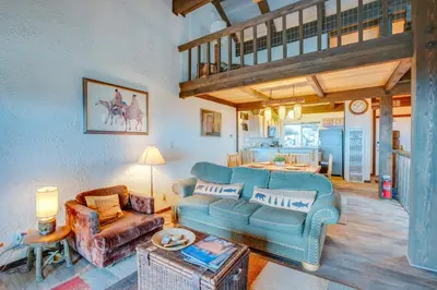 a living room with a couch and a table at 1 Mi to Stagecoach Lift! Homey Tahoe Townhome in Stateline