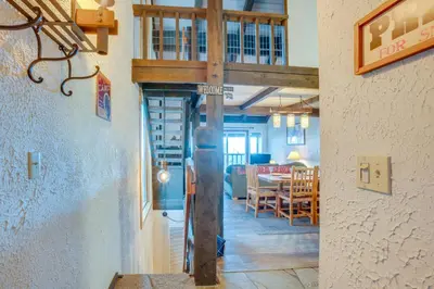 a large wooden cross in a room with a dining room at 1 Mi to Stagecoach Lift! Homey Tahoe Townhome in Stateline
