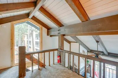 a room with a balcony with a large window at 1 Mi to Stagecoach Lift! Homey Tahoe Townhome in Stateline