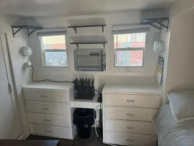 a bedroom with a desk and a bed in a camper at Midtown Charm: 1BR Urban Pad in Reno