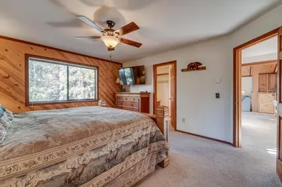 a bedroom with a bed and a ceiling fan at Home 1 Mi to Downhill Ski Resort Bring Your Pets! in Truckee