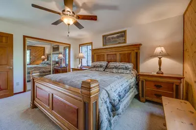 a bedroom with a bed and a ceiling fan at Home 1 Mi to Downhill Ski Resort Bring Your Pets! in Truckee