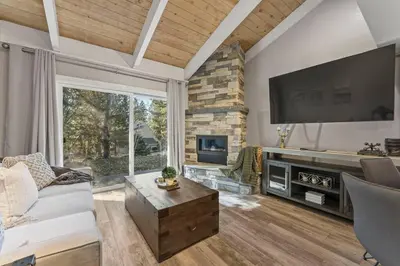 a living room with a fireplace and a tv at Tahoe Bliss: Ski, Hike, & Relax in Incline Village