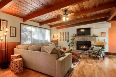 a living room with a couch and a fireplace at Orange Door Electric Fireplace bbq in Oakhurst