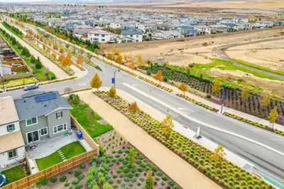 an aerial view of a city with a road at Newly Built Tracy Home with Backyard and Pool Access! in Tracy