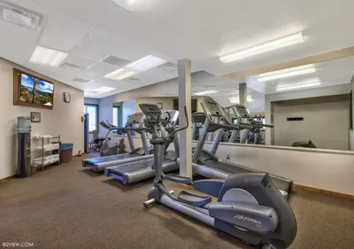 a gym with treadmills and ellipticals in a room at Private beach, Close to ski, Resort Amenities! in South Lake Tahoe
