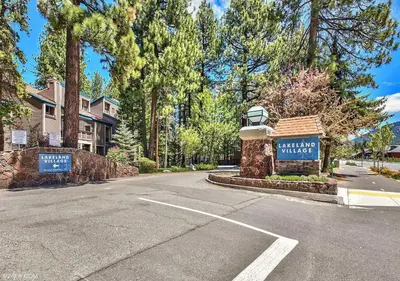 a street with a welcome sign and a house at Private beach, Close to ski, Resort Amenities! in South Lake Tahoe