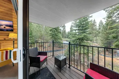 a screened porch with a view of the woods at Carnelian Woods # 59 - 2 BR Carnelian Bay Retreat - Minutes to Lake w HOA Amenities in Carnelian Bay