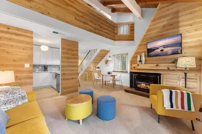 a living room with wood paneling and a fireplace at Carnelian Woods # 59 - 2 BR Carnelian Bay Retreat - Minutes to Lake w HOA Amenities in Carnelian Bay