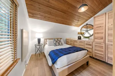 a bedroom with a bed and a wooden ceiling at Carnelian Woods # 59 - 2 BR Carnelian Bay Retreat - Minutes to Lake w HOA Amenities in Carnelian Bay