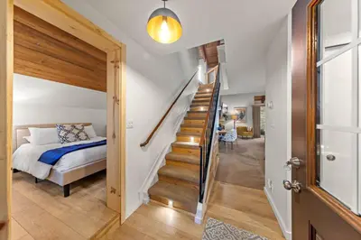 a bedroom with a staircase and a bed in a room at Carnelian Woods # 59 - 2 BR Carnelian Bay Retreat - Minutes to Lake w HOA Amenities in Carnelian Bay