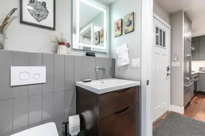 a bathroom with a sink and a mirror at Luxurious 2BD Smart Home Near Beach in Tahoe City