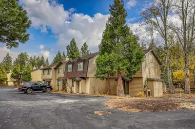 a house with a car parked in the driveway at Luxurious 2BD Smart Home Near Beach in Tahoe City