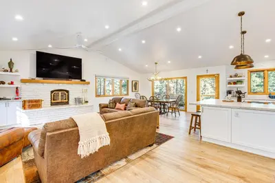 a living room with a couch and a fireplace at 4 Mi to Slopes Family-Friendly Stateline Home! in Stateline