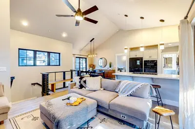 a living room with a couch and a kitchen at Twilight's Rest in Zephyr Cove