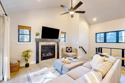 a living room with a couch and a fireplace at Twilight's Rest in Zephyr Cove