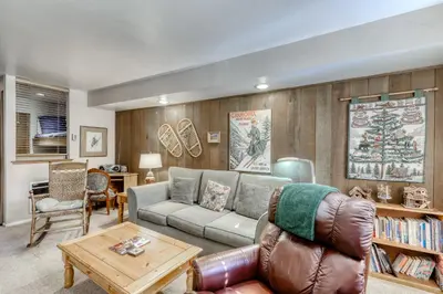 a living room with a couch and a table at Horizons 4 101 in Mammoth Lakes