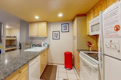 a small kitchen with a sink and a refrigerator at Horizons 4 131 in Mammoth Lakes