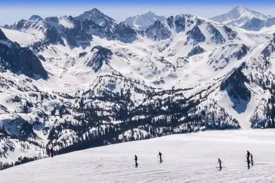 a group of people skiing down a snow covered mountain at Horizons 4 131 in Mammoth Lakes