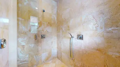 a bathroom with a shower with a glass door at Obsidian #1 home in Mammoth Lakes