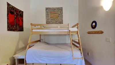 a bunk bed in a room with a ladder at 1849 Condos 631 home in Mammoth Lakes