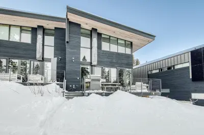 a building with a pile of snow in front of it at Stellar Ski-in Ski-out Out # 2 at Northstar 2 by Tahoe Getaways - Pet-Friendly 3BR Townhome w Loft, Shuttle and HOA! in Truckee-Tahoe Airport