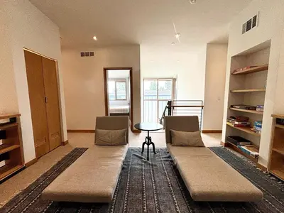 a living room with two chairs and a table at Stellar Ski-in Ski-out Out # 2 at Northstar 2 by Tahoe Getaways - Pet-Friendly 3BR Townhome w Loft, Shuttle and HOA! in Truckee-Tahoe Airport