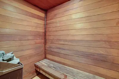 a wooden sauna with a bench in the corner at Mammoth Lakes Condo Walk to Village and Gondola! in Mammoth Lakes